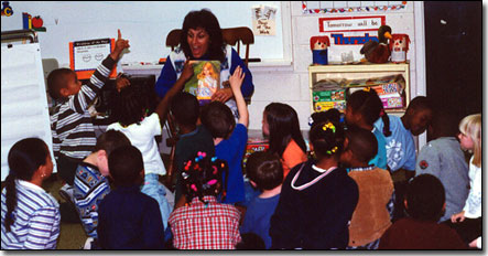 Tita reading to a class